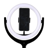 LED ring light mounted on tripod with smartphone holder rotated 360 degrees for perfect shot.