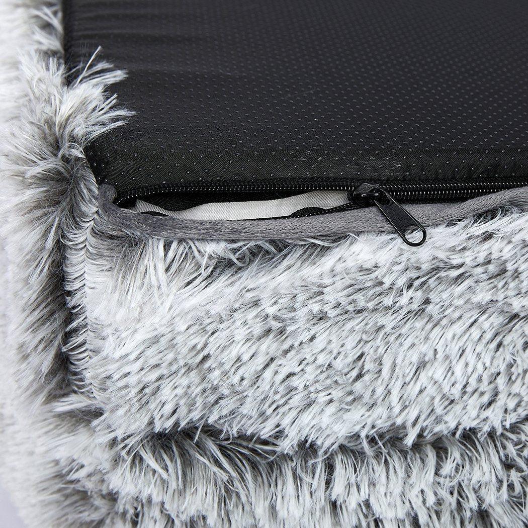 Side angle showing soft plush pet bed mattress with raised supportive edges for pet comfort