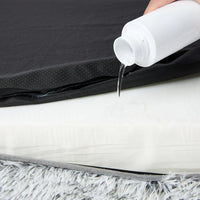 Orthopedic pet bed laying flat on floor with thick cushioning and plush cover