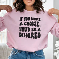 Close-up of peach sweatshirt fabric and printed text with warm fleece lining visible.