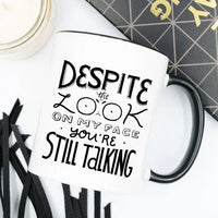 Close-up of the coffee mug showing humorous text message in bold black font