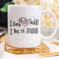Side view of the white mug showing the full funny phrase in black lettering.