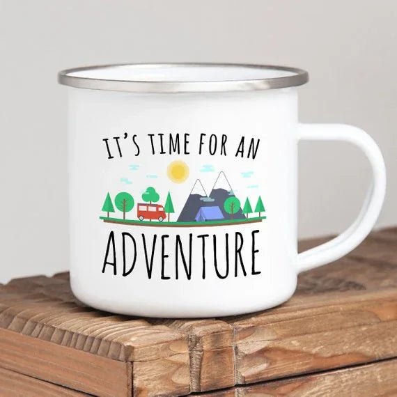 Close-up of enamel mug showing colorful wilderness and travel graphic print