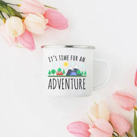 White enamel mug with black rim showcasing vibrant outdoor adventure artwork on both sides