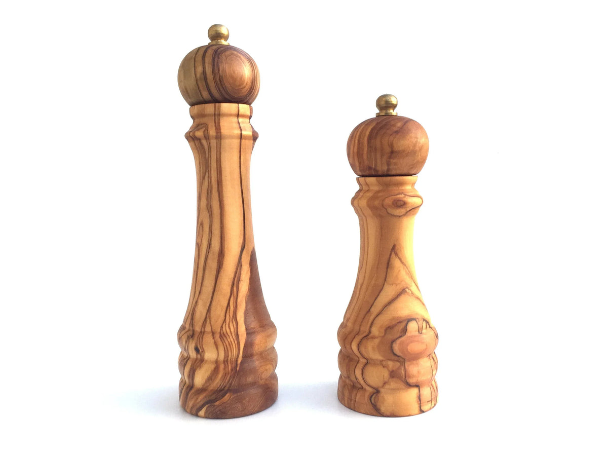 Close-up of the top grinding mechanism of a wooden pepper mill.
