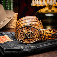 Lifestyle image of man wearing the IOWA mustard brown caiman crocodile belt with jeans