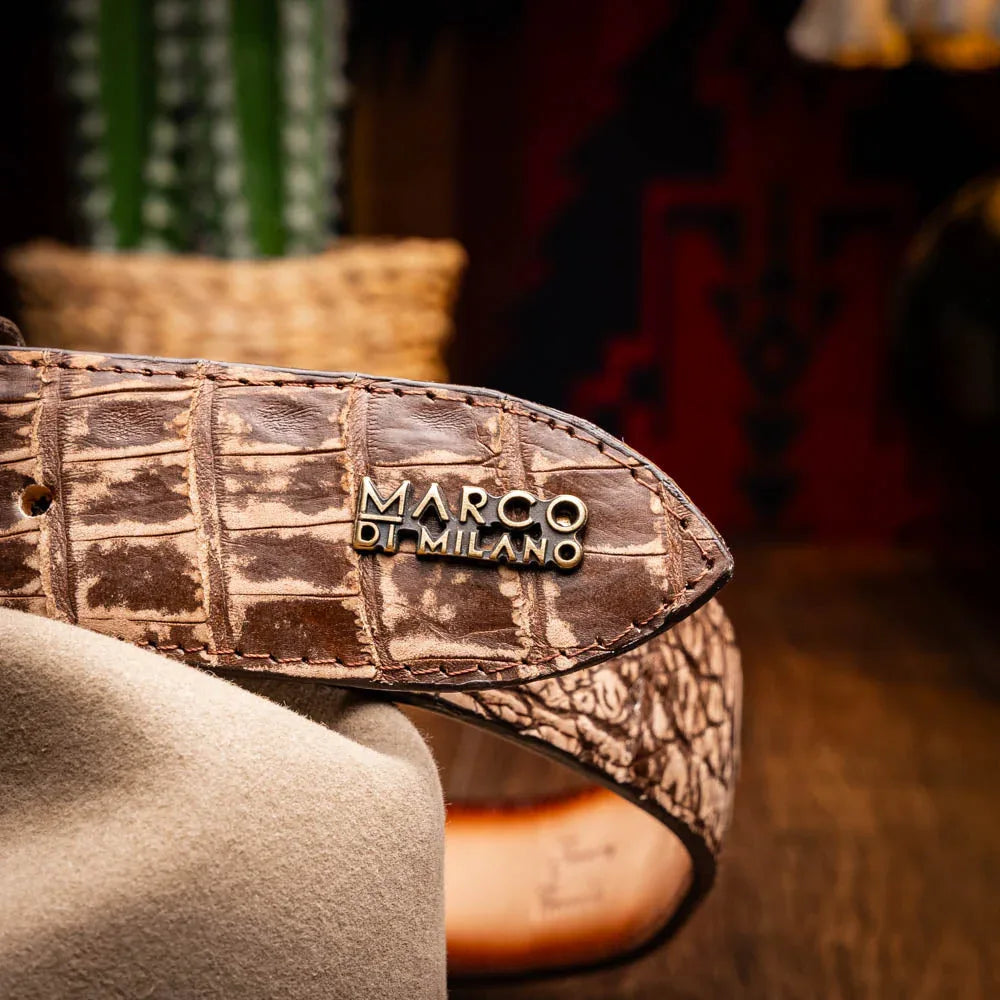 Lifestyle shot showing person adjusting stone brown caiman crocodile Iowa Belt with antique buckle.