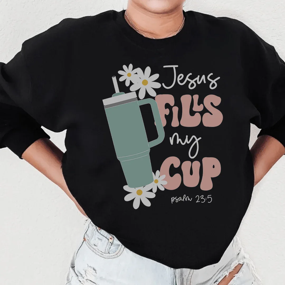 Black sweatshirt with "Jesus Fills My Cup Psalm" white text design on front.