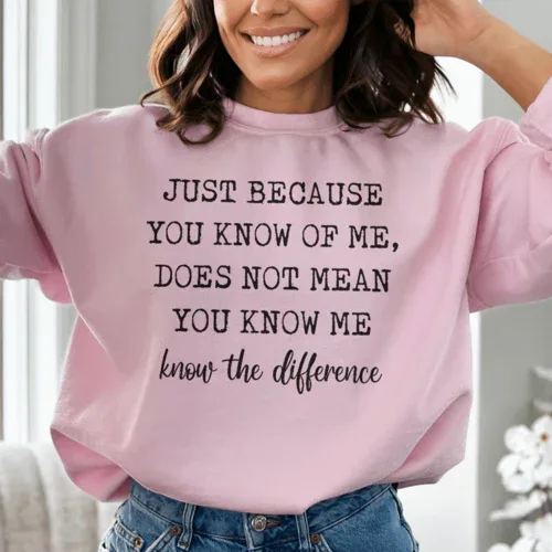 Peach colored sweatshirt featuring bold white text 'Just Because You Know Me Does Not Mean You Know Me'.
