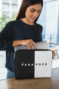Sleek black and white color block laptop sleeve with a modern design, shown closed on a plain background.