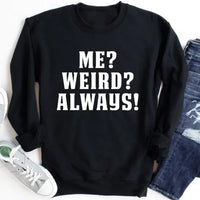 Black fleece sweatshirt displaying white 'Me? Weird? Always!' slogan on front, snug fit with comfy cuffs.