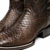 Missouri cowboy boot angled to show contrast between python skin vamp and smooth leather shaft.