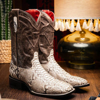 Lifestyle image of person wearing Missouri Natural boots with jeans outdoors.