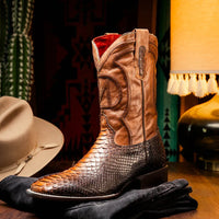Side view of Missouri Lisboa python skin cowboy boot worn outdoors, illustrating square toe and premium leather details.