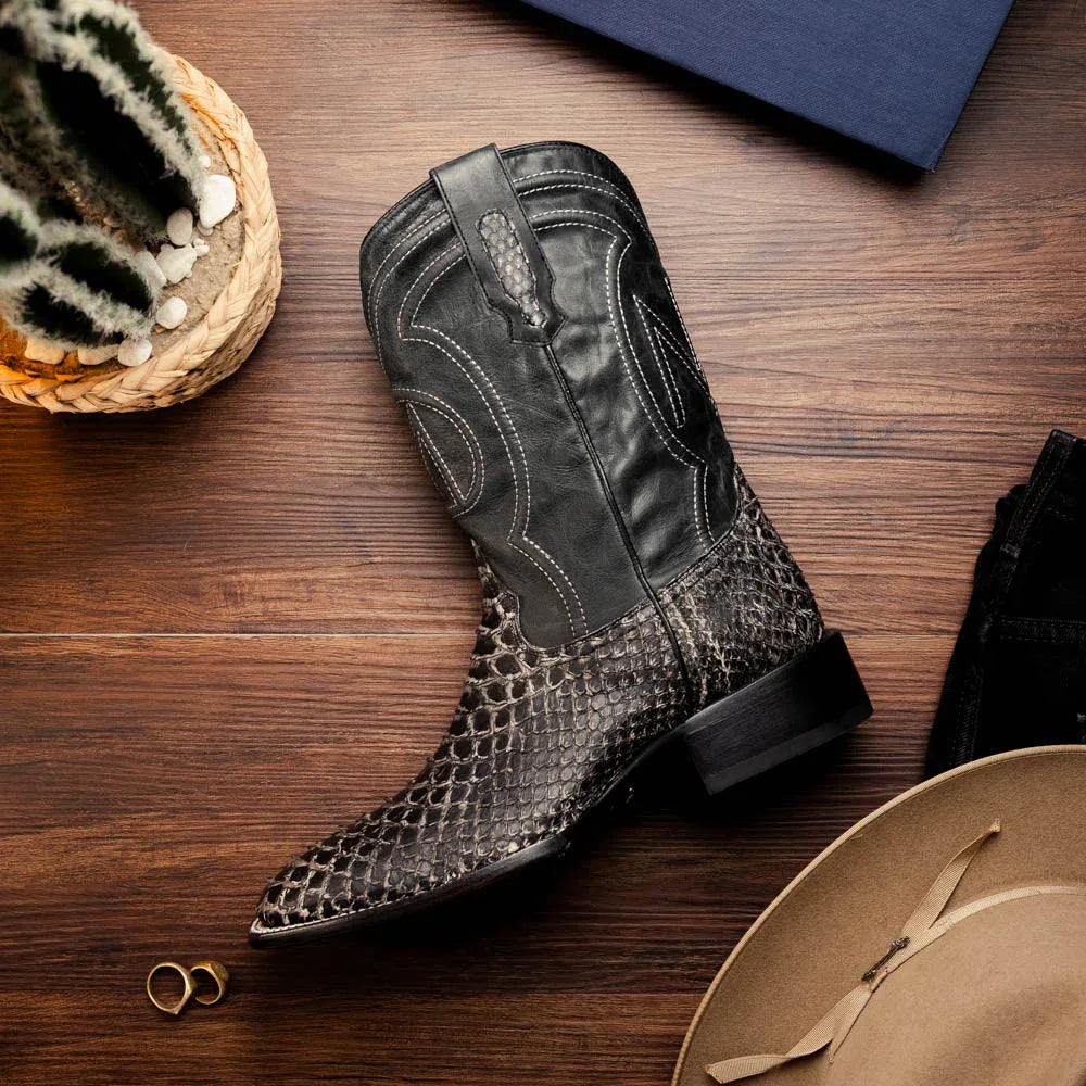 White python skin cowboy boots worn outdoors highlighting the premium craftsmanship and design.