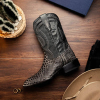White python skin cowboy boots worn outdoors highlighting the premium craftsmanship and design.