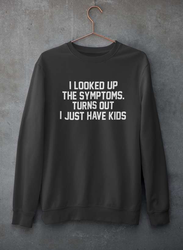 Crewneck sweatshirt hanging on concrete wall, plain light gray with soft fleece lining visible at collar.