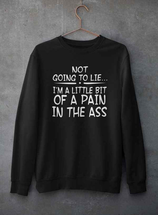 Light gray crewneck sweatshirt with bold black text 'Not Going To Lie... Im A Little Bit Of A Pain In The Ass' hanging on