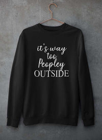 Customizable crewneck sweatshirt hanging against a concrete wall, showcasing a soft cotton/poly fleece blend.