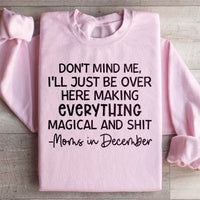 Light pink Moms In December sweatshirt with fleece lining and adjustable banded cuffs.