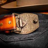Close shot of Montana Belt on waist, focusing on hand-stitched detail and layered leather craftsmanship.