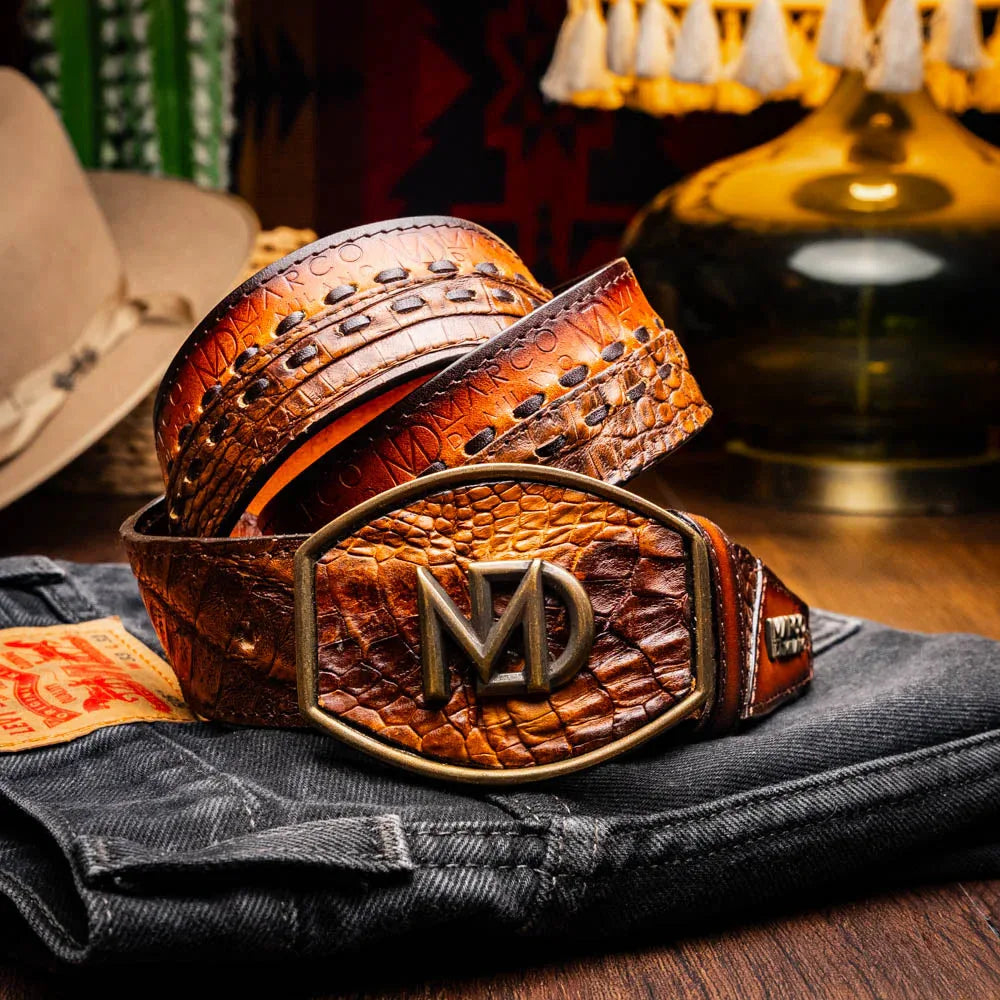Model wearing Montana belt over jeans capturing its Western style and antique brass buckle.