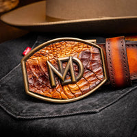 Montana belt styled with Western-inspired outfit, focusing on rich leather textures and buckle.