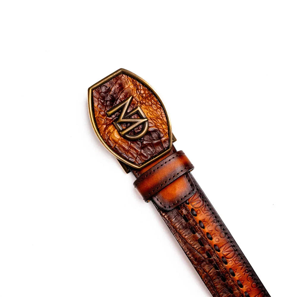 Montana Western belt laid flat highlighting antique brass buckle and embossed Marco Di Milano stamp.