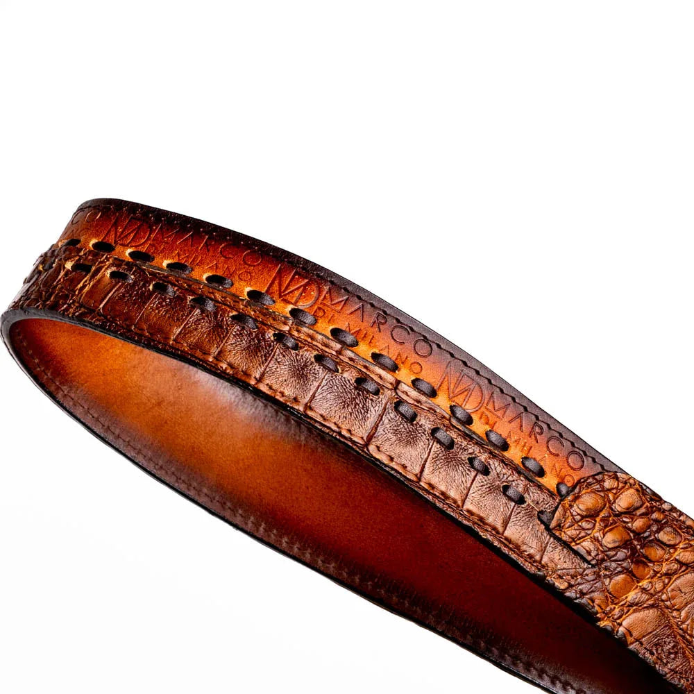 Full length of Montana belt coiled, showcasing rugged, luxurious materials and craftsmanship.