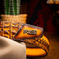 Woman styling Montana Belt in mustard brown with casual outfit outdoors.