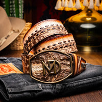 Lifestyle shot of person wearing Montana stone brown caiman crocodile and calfskin belt with jeans