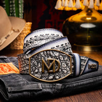 Model wearing gray Montana belt with jeans, showcasing western style leather and brass buckle.