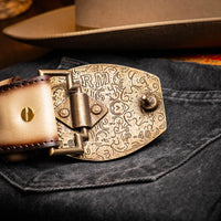 Styled photo of Montana belt with hand-stitched center detail worn over casual denim wear.