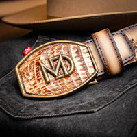 Montana belt displayed on person in Western-inspired outfit, emphasizing craftsmanship and design.