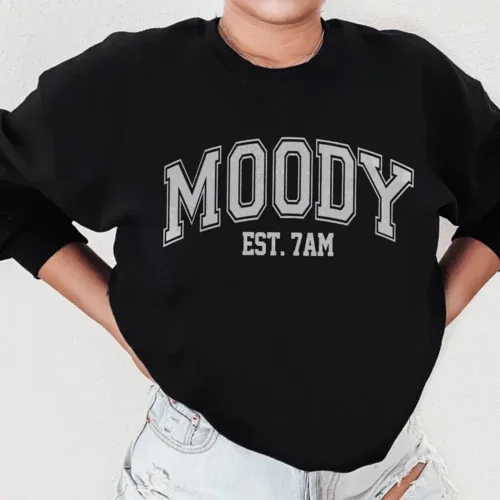 Close-up of black Moody Est. 7am sweatshirt with peachy Sunday t-shirt print in size small.