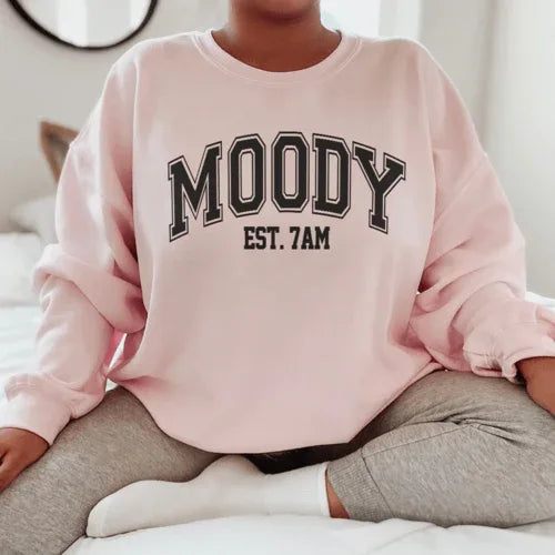 Light pink Moody Est. 7am sweatshirt with peachy Sunday t-shirt graphic shown in size small.