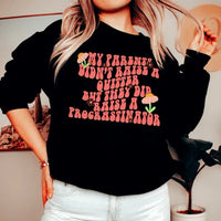 Black sweatshirt displayed flat showing front with the phrase 'My Parents Didn't Raise A Quitter' in bold white text.