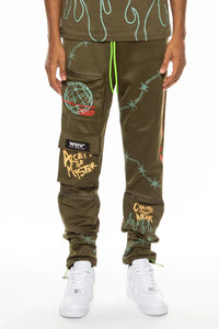 Olive green men's track pants displayed flat, featuring pouch pockets with zippers