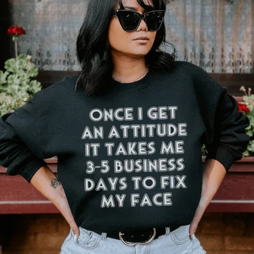 Black sweatshirt featuring white 'Once I Get An Attitude' text centered on chest.