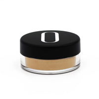 Gold highlighter powder texture with soft light reflections