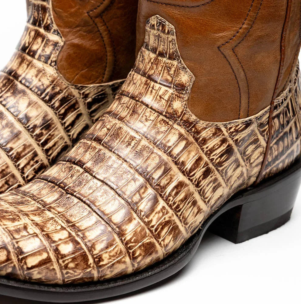 Profile angle of Phoenix Stone Orix boot displaying polished leather shaft and distinctive western design