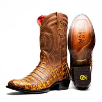 Close-up of a mustard brown cowboy boot made with genuine caiman belly skin and full-grain leather shaft.