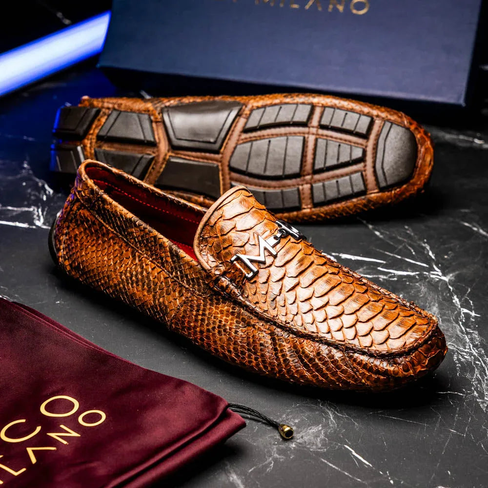 Model wearing Pia Cognac python driving shoes outdoors with casual outfit.