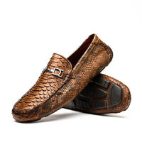 Close-up of Pia Cognac python leather driver shoe showing rich texture and stitching detail.