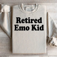 Sand-colored fleece sweatshirt with 'Retired Emo Kid' graphic, super warm and cozy.