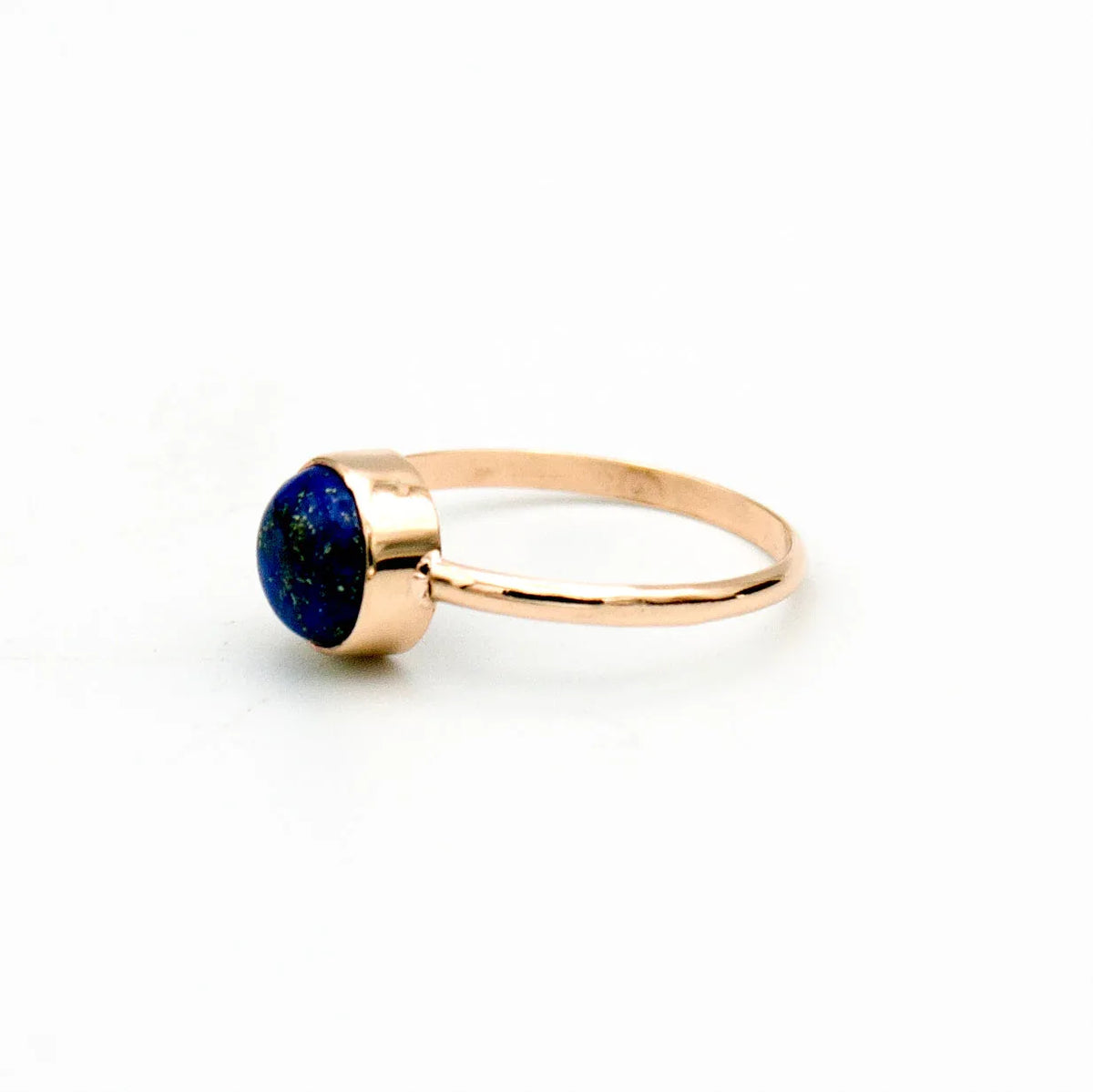 Lapis Lazuli round cabochon ring in 14k gold filled band displayed on hand showing gemstone details.