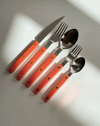Side angle of dopamine cutlery set showing fork and spoon handles with a sleek finish.