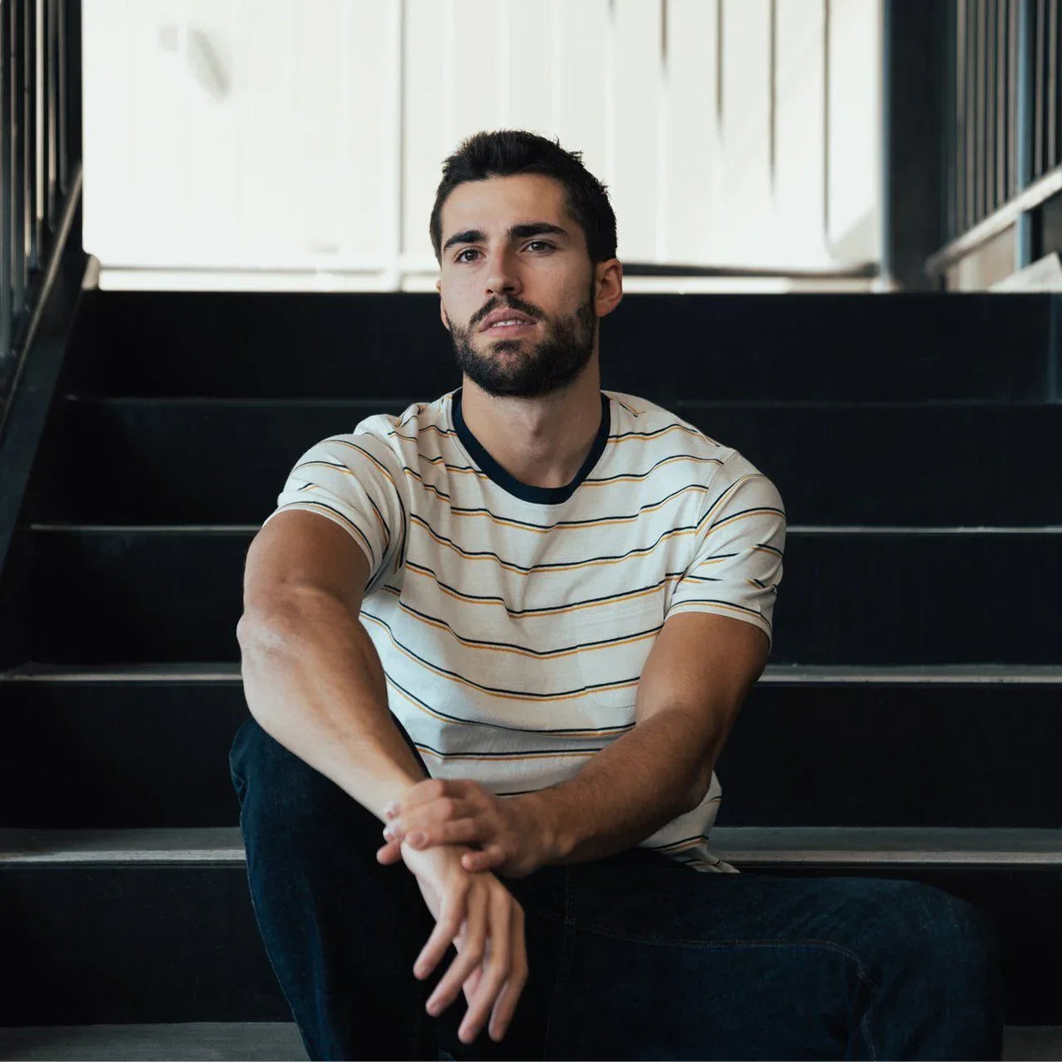 Close-up of Edgar Striped Tee fabric texture highlighting yarn-dyed stripes and pocket detail.