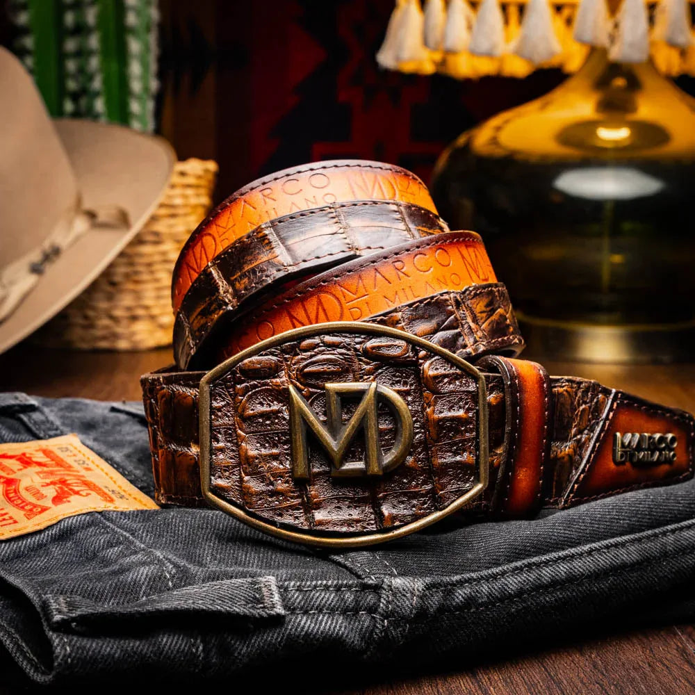 Lifestyle image showing the Texas Belt worn with denim jeans outdoors in natural light.