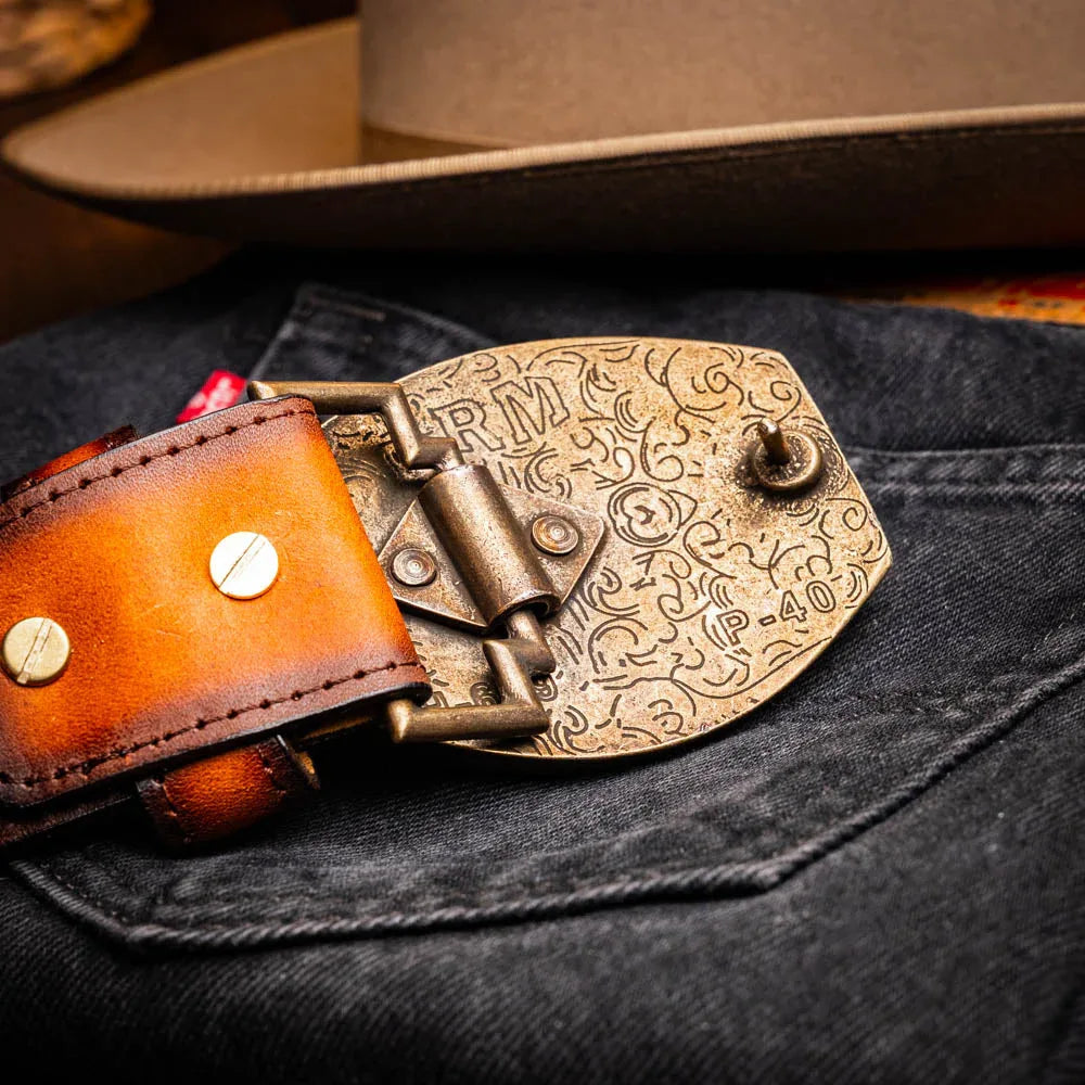 Model wearing the Texas Belt waist-facing camera, pairing it with rugged casual attire.